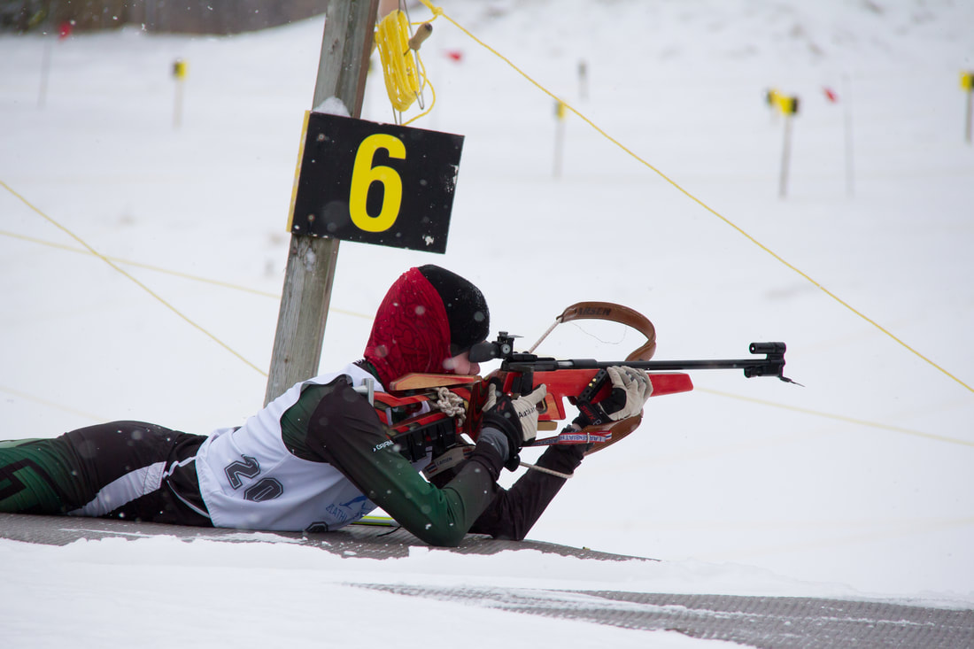 What type of rifle is used in biathlon?